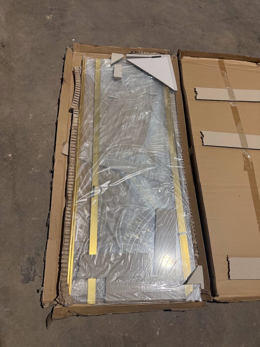 Boxed frameless shower door